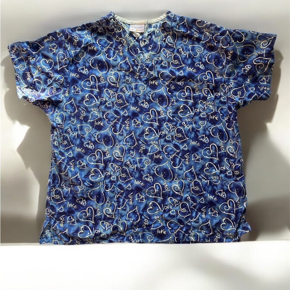 Blue scrub with hearts on it